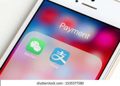 Portland, OR, USA - Oct 18, 2019: WeChat and Alipay mobile app icons are seen on an iPhone. WeChat Pay and Alipay are the two dominating mobile payment platforms in mainland China.