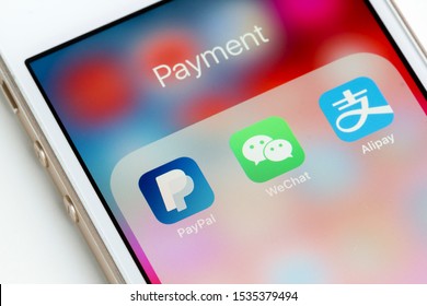 Portland, OR, USA - Oct 18, 2019: PayPal, WeChat Pay and Alipay mobile app icons are seen on an iPhone.