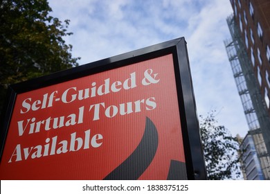 Portland, OR, USA - Oct 20, 2020: The Self-Guided And Virtual Tours Available Sign On The Sidewalk Outside A Real Estate Rental Property In Downtown Portland, Oregon, During A Pandemic Fall Season.