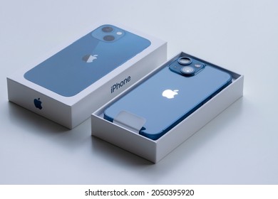 Portland, OR, USA - Sep 30, 2021: Apple's new iPhone 13 mini (blue) isolated on a white background.
