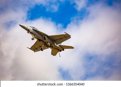 Portland, Oregon - 8/7/2016: F-16 us airforce military fighter aircraft flying in blue sky with clouds at the Hillsboro-Portland Oregon air show.