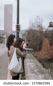 Portland, Oregon - Nov 16, 2019 : Two Asian Traveler Looking At William River On Burnside Bridge In Downtown Portland