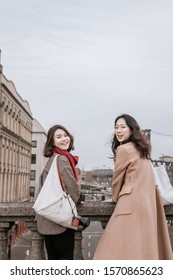 Portland, Oregon - Nov 16, 2019 : Two Asian Traveler Posing At Burnside Bridge In Downtown Portland