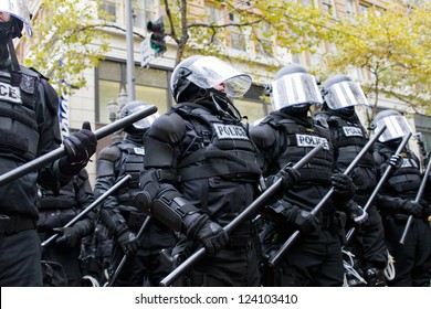 PORTLAND, OREGON - NOV 17: Police In Riot Gear Holding The Line In Downtown Portland, Oregon During A Occupy Portland Protest On The First Anniversary Of Occupy Wall Street November 17, 2011