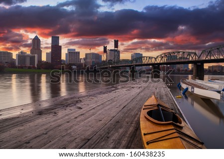 Portland, Oregon Panorama.  Sunset scene with dramatic sky and light reflections on the Willamette River.