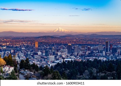 Portland, Oregon seen toward the east with Mt. Hood towering in the background in the sunset.
