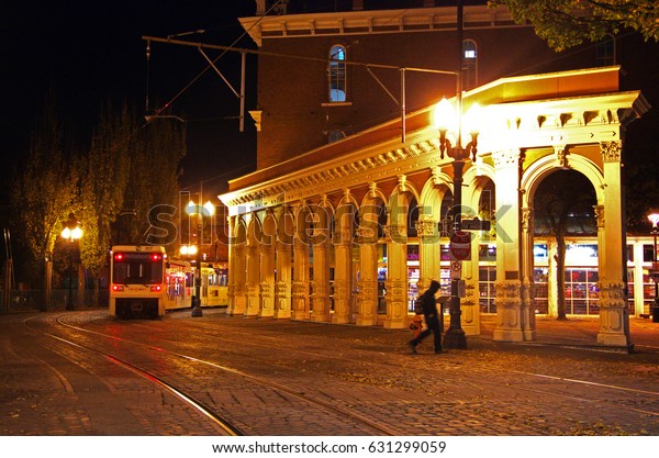 PORTLAND, OREGON, UNITED STATES - NOV 7, 2012: A\
light rail train turning a corner at the city of Portland OR at\
night. Editorial Use\
Only.