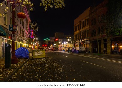 Portland, Oregon, USA - April 1st, 2021: Business Buildings In Neighborhood With Homeless' Tents In Night