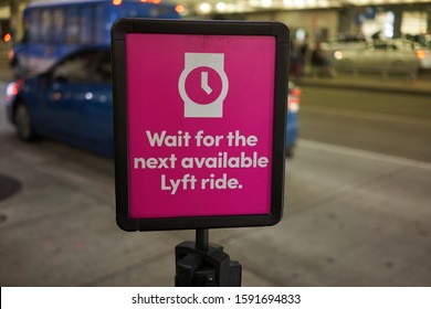 Portland, Oregon, USA - Dec 4, 2019: A Sign At The Lyft PIN Code Pickup Area In Portland International Airport At Night.