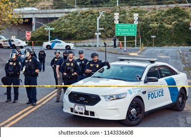 Portland, Oregon / USA - July 20, 2018: ICE Cops Stand In A Line Behind Police Tape At The Occupy ICE Camp 