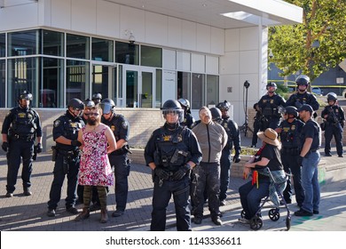 Portland, Oregon / USA - July 20, 2018: ICE Cops Arrest Peaceful Protesters For Crossing Police Tape Line At OccupyICE Camp