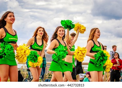 Portland, Oregon, USA - June 11, 2016: University of Oregon Duck Truck, Pep Band, Cheerleaders and Duck in the Grand Floral Parade during Portland Rose Festival 2016.