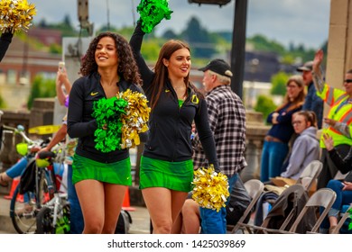 Portland, Oregon, USA - June 8, 2019: University or Oregon cheerleaders in the Grand Floral Parade, during Portland Rose Festival 2019.
