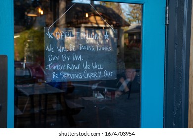 Portland, Oregon / USA - March 16 2020: A Sign In The Window Of TwentySix Cafe Spells Out The Uncertainty Of Business Operations In The Onset Of The COVID-19 Coronavirus Pandemic