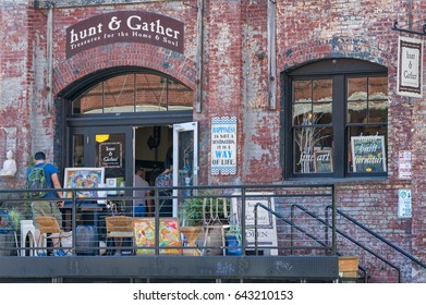 Portland, Oregon, USA - September 20, 2014: A storefront with a variety of things for sale at it's entrance, into an old warehouse building, entices shoppers in Portland, Oregon