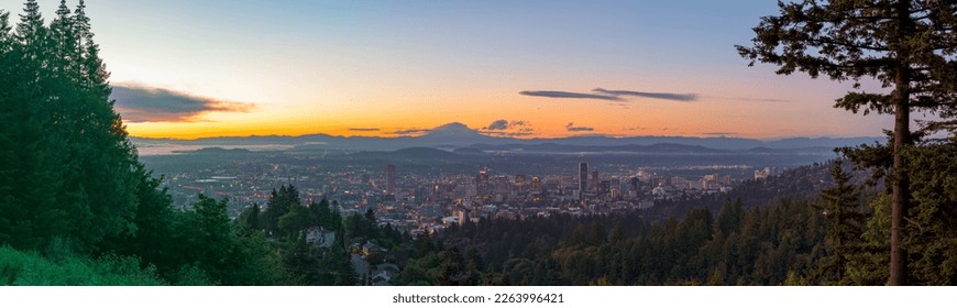 Portland, Oregon, USA skyline panorama at dawn with Mt. Hood in the distance at dawn.