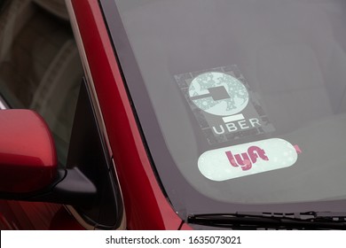 Portland, Oregon/USA-February 1, 2020: Lyft And Uber Signs On A Rideshare Vehicle On The Street