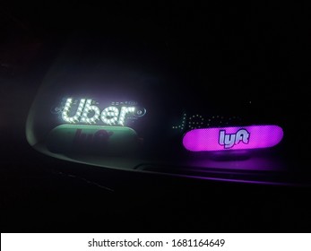 Portland, Oregon/USA-March 23, 2020: Uber And Lyft Rideshare Driving Car Waiting For A Client At Late Night In Empty Streets Of Portland. Because Of New Coronavirus The Rides Are Cut Almost 80% Less. 