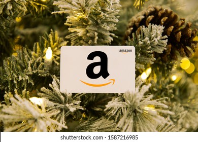 Portland, OR / USA - December 12, 2019: Amazon logo gift card in pine tree with holiday theme