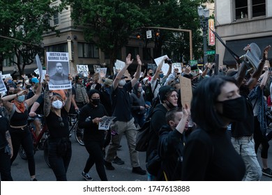 Portland, OR / USA - June 1 2020: Large Crowd Of Protesters Holding Signs And Banners At Downtown Demonstration Against George Floyd Killing.