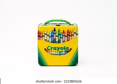 Portland, OR / USA - October 25 2018: Metal box with Crayola crayons, isolated on white background.