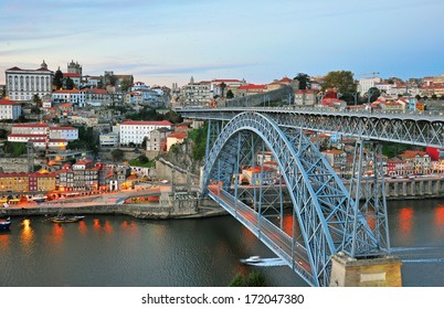 Porto bridge and panorama of historical centre of city on sunset