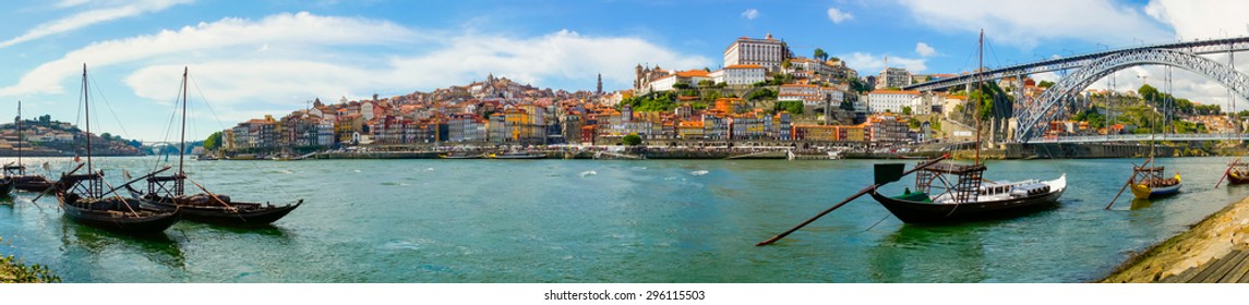 Porto old town skyline on the Douro River with rabelo boats