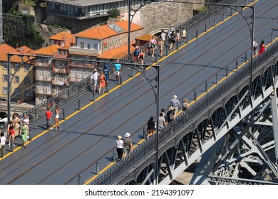 Porto, Portugal - 07 23 2022: The Historic D. Luís I Irom Bridge Over The Douro River That Connects The Cities Of Porto And Vila Nova De Gaia