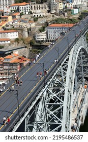 Porto, Portugal - 07 23 2022: The Historic D. Luís I Irom Bridge Over The Douro River That Connects The Cities Of Porto And Vila Nova De Gaia