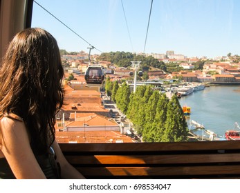 Porto, Portugal - Circa October 2013: Woman Inside Cable Car (teleferico De Gaia) In Porto, Portugal