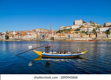 Porto, Portugal - December 26, 2020: Boats with porto wine in Porto, Portugal. Douro River