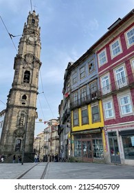 Porto, Portugal - February 12 2022. Stunning Street View Of Traditional Architecture Buildings With Colorful Azulejo Tiles Facade Decoration And Igreja Dos Clérigos Church Tower