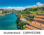 Porto, Portugal: hills of Vila Nova de Gaia with Monastery of Serra do Pilar, wine cellars and Ponte Infante D Henriques bridge over Duoro river