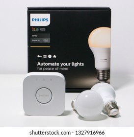 Porto, Portugal - March 3 2019: Philips Hue Smart Lighting Bulbs And Hub Bridge With Box On White Background