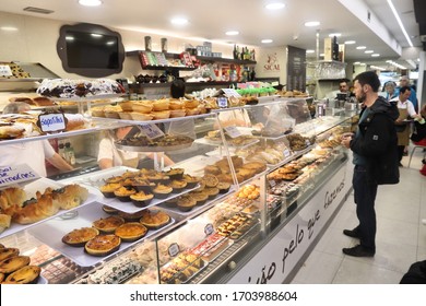 PORTO, PORTUGAL - MAY 24, 2018: People Visit Typical Local Bakery And Confectionery Shop In Porto, Portugal. Porto Is The 2nd Largest City In Portugal. Its Old Town Is A UNESCO World Heritage Site.