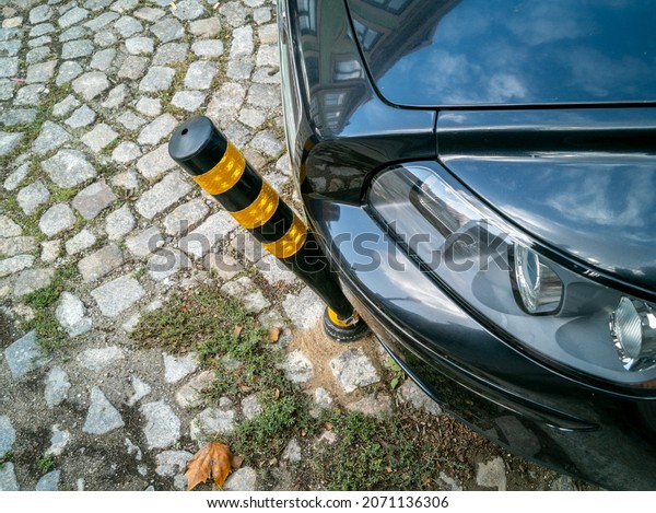 Porto, Portugal - October\
4, 2020 car ran over and bent an anti-parking pole, an accident in\
the city