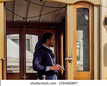 Porto, Purtugal. 15 November 2019. Driver Of Historic Streetcar In The Front Of A Traditional Streetcar Seen From The Outside.