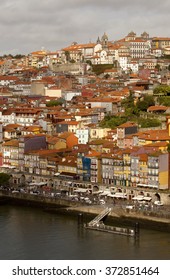 Porto Runs Down A Steep River Bank. The River Douro Has Cut A Deep River Path Through The Landscape Where Porto The Historical Town Has Been Built. Porto Cascades Down These Steep River Banks.