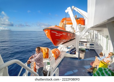 PORTO SANTO, PORTUGAL - AUGUST 26, 2021: Unidentified Passengers Enjoy A Ocean Voyage On The Deck Of A Sea Ferry.