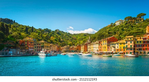 Portofino luxury travel destination. Village, yachts and boats in little marina. Liguria region, Italy