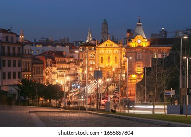 Porto/Portugal; 01/20/2017. Santo António Dos Congregados Church And Porto - São Bento Railway Station From Dom Alfonso Heriques Avenue, In Porto At Sunset.