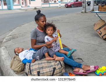 PORTOVIEJO,MANABI, ECUADOR, February 02 2019.  Venezuelan Refugee family asking for money in an Ecuadorian city, February 02 2019.Many refugees from Venezuela are living on the street in Ecuadorian