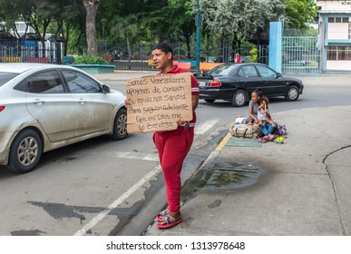 PORTOVIEJO,MANABI, ECUADOR, February 02 2019.  Venezuelan Refugee family asking for money in an Ecuadorian city, February 02 2019.Many refugees from Venezuela are living on the street in Ecuadorian