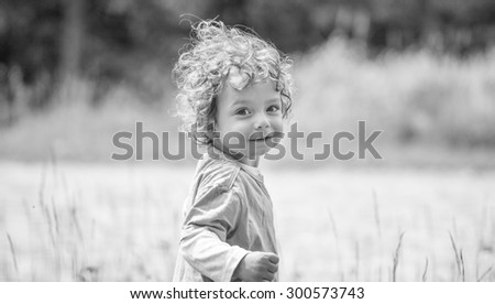 Similar – Small child with long blond hair enjoying of a sunny day