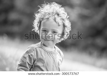 Similar – Small child with long blond hair enjoying of a sunny day