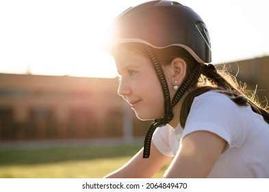 Portrait Of An 11 Year Old Girl In A Protective Sports Helmet