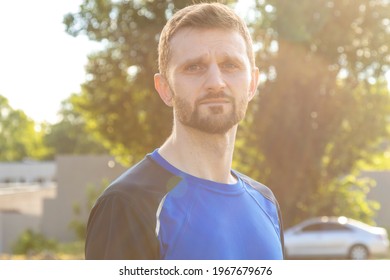 Portrait Of A 30 Year Old Man With A Beard. In Sportswear After Training.