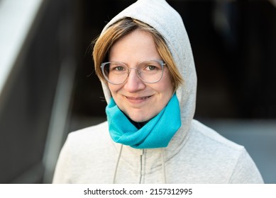 Portrait Of A 35 Year Old Woman Wearing A Hoody, Looking Confident