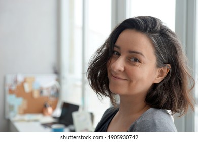 Portrait Of 38 Year Old Woman Against Home Office Background