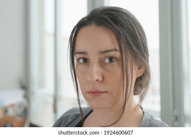 Portrait Of 38 Year Old Woman Against Home Office Background